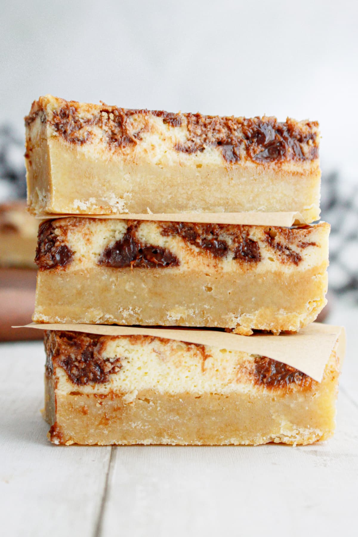 three nutella bars stacked on top of each other on a wooden background.