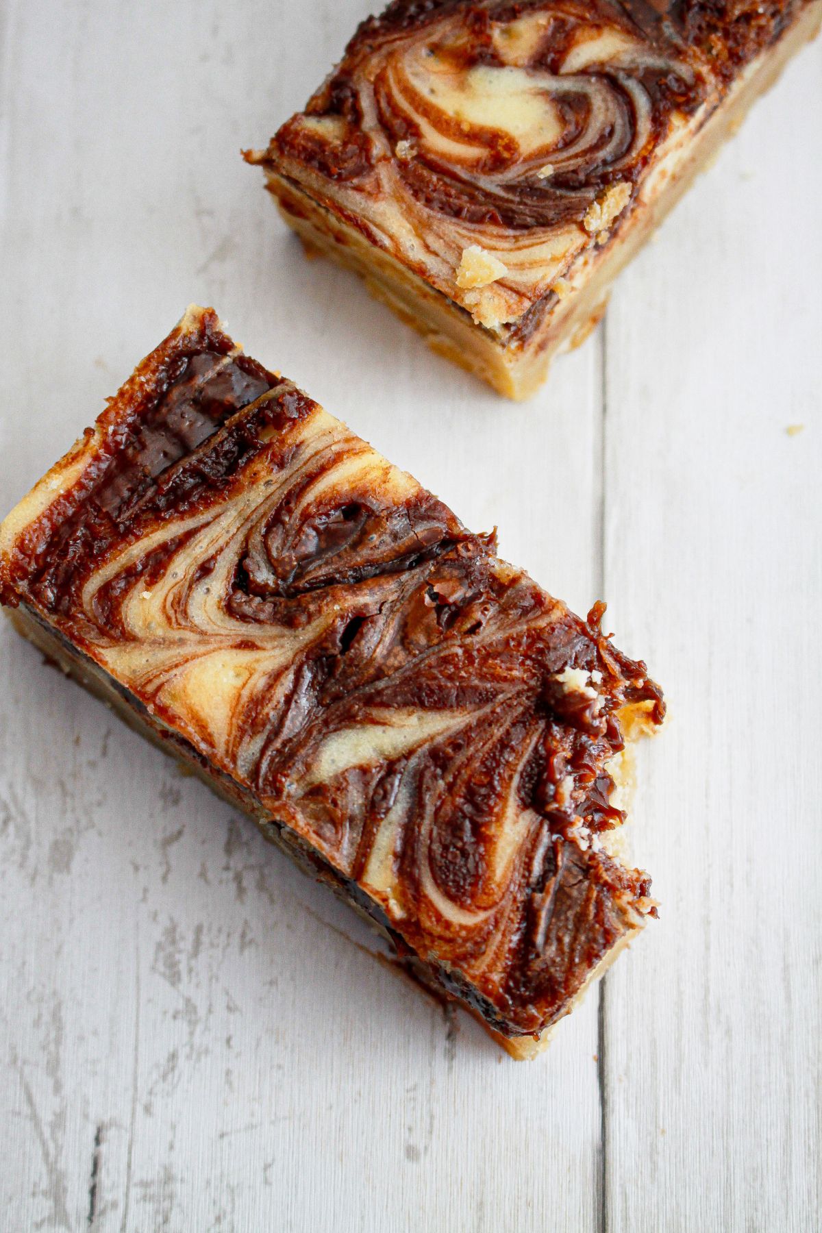 two nutella bars on a wooden background.