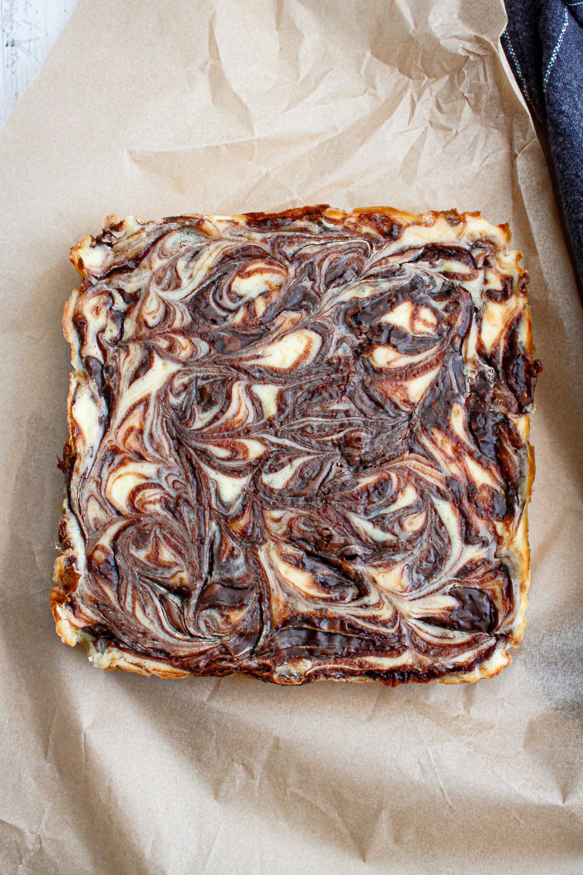 uncut nutella bars on a piece of parchment paper.