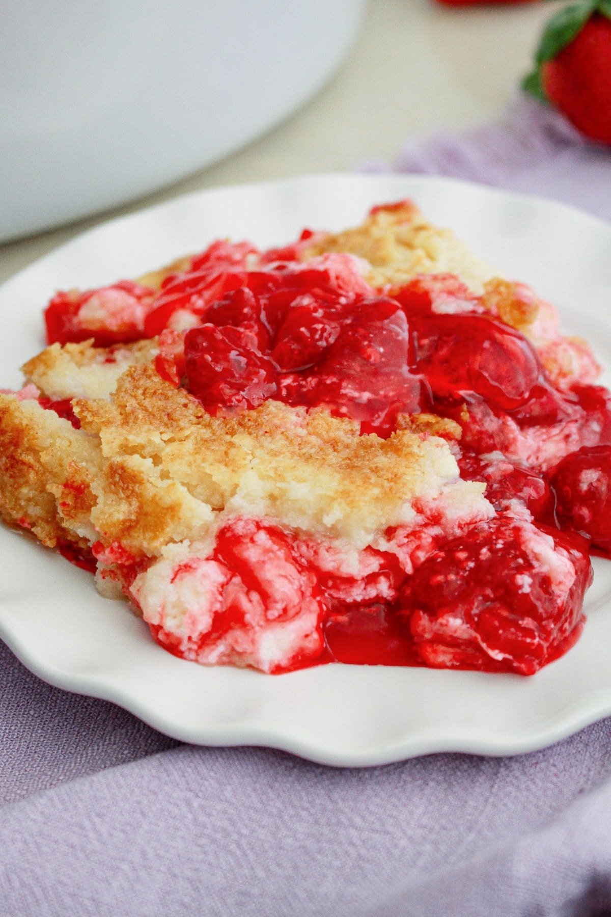 plate full of strawberry dump cheesecake.