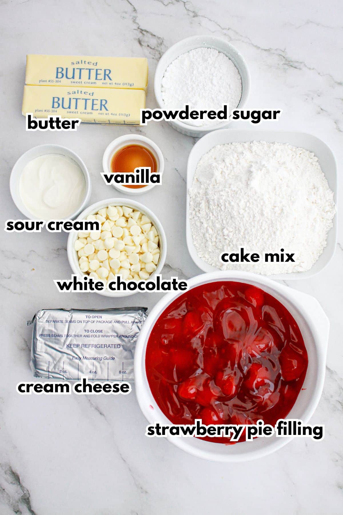 butter, powdered sugar, sour cream, vanilla, white chocolate, cake mix, cream cheese, and strawberry pie filling.