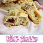white cheddar scones stacked on top of each other.