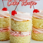 three mini cherry almond cakes on a small plate.