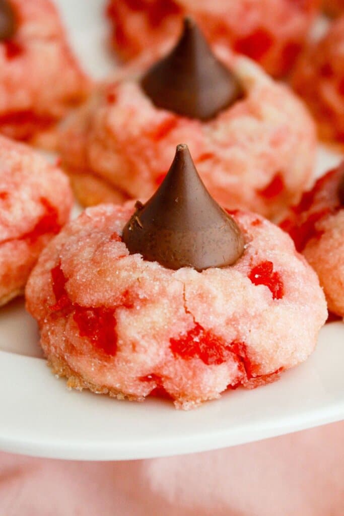 cherry blossom cookies on a plate.