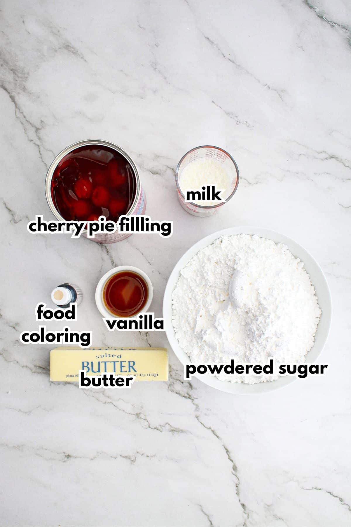 bowls of cherry pie filling, milk, food coloring, butter, vanilla extract, and powdered sugar on a counter.