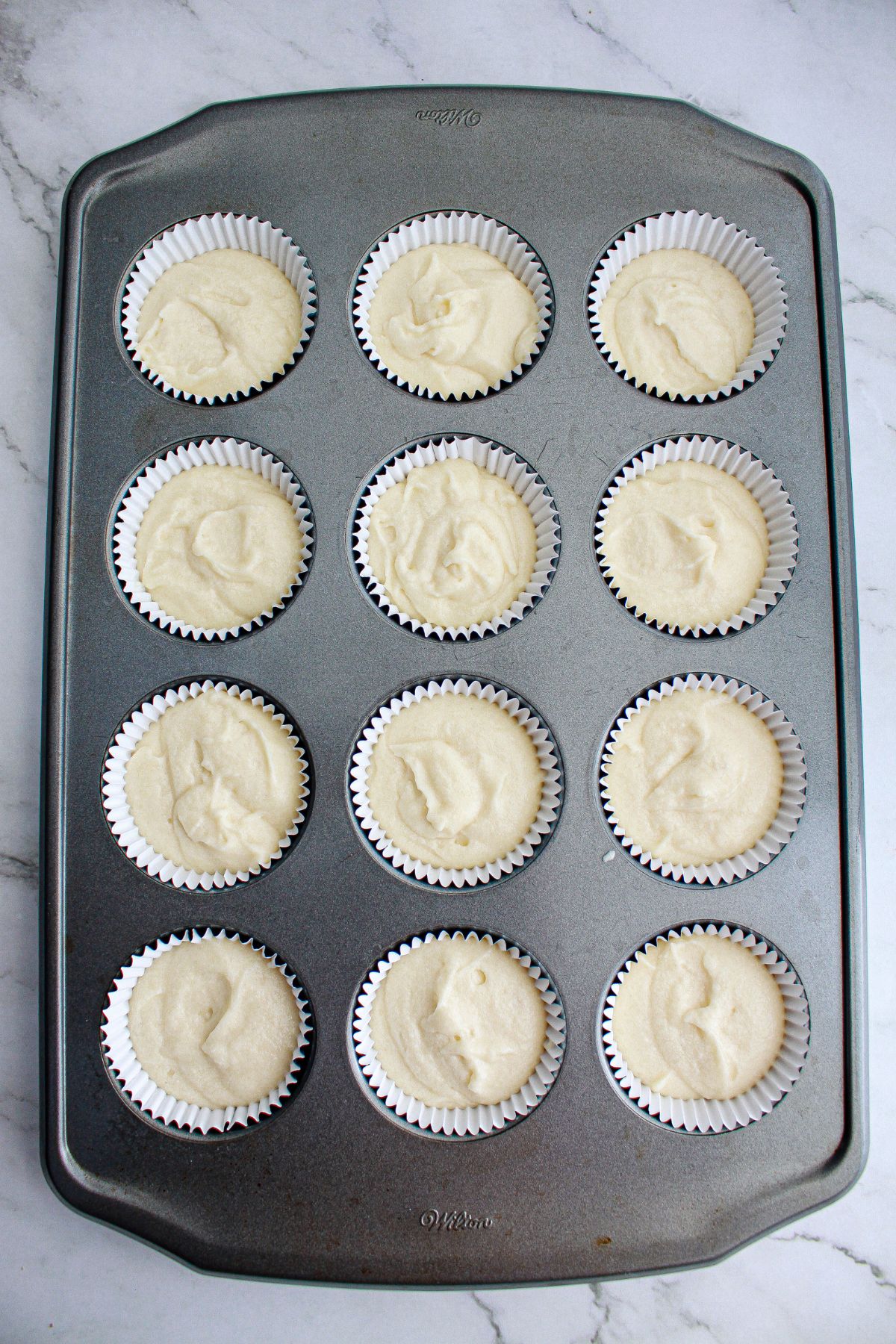cupcake batter in a muffin pan.