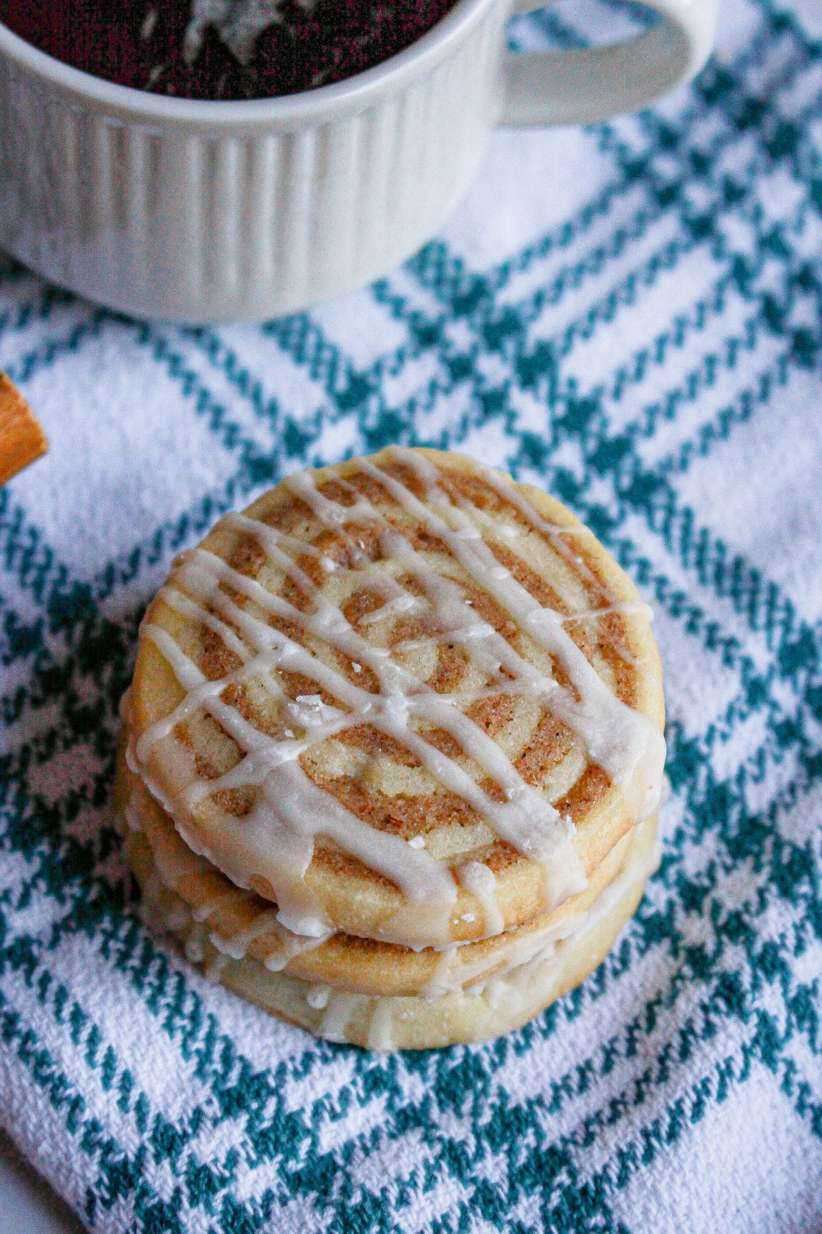 three cinnamon bun cookies being stacked on top of each other.