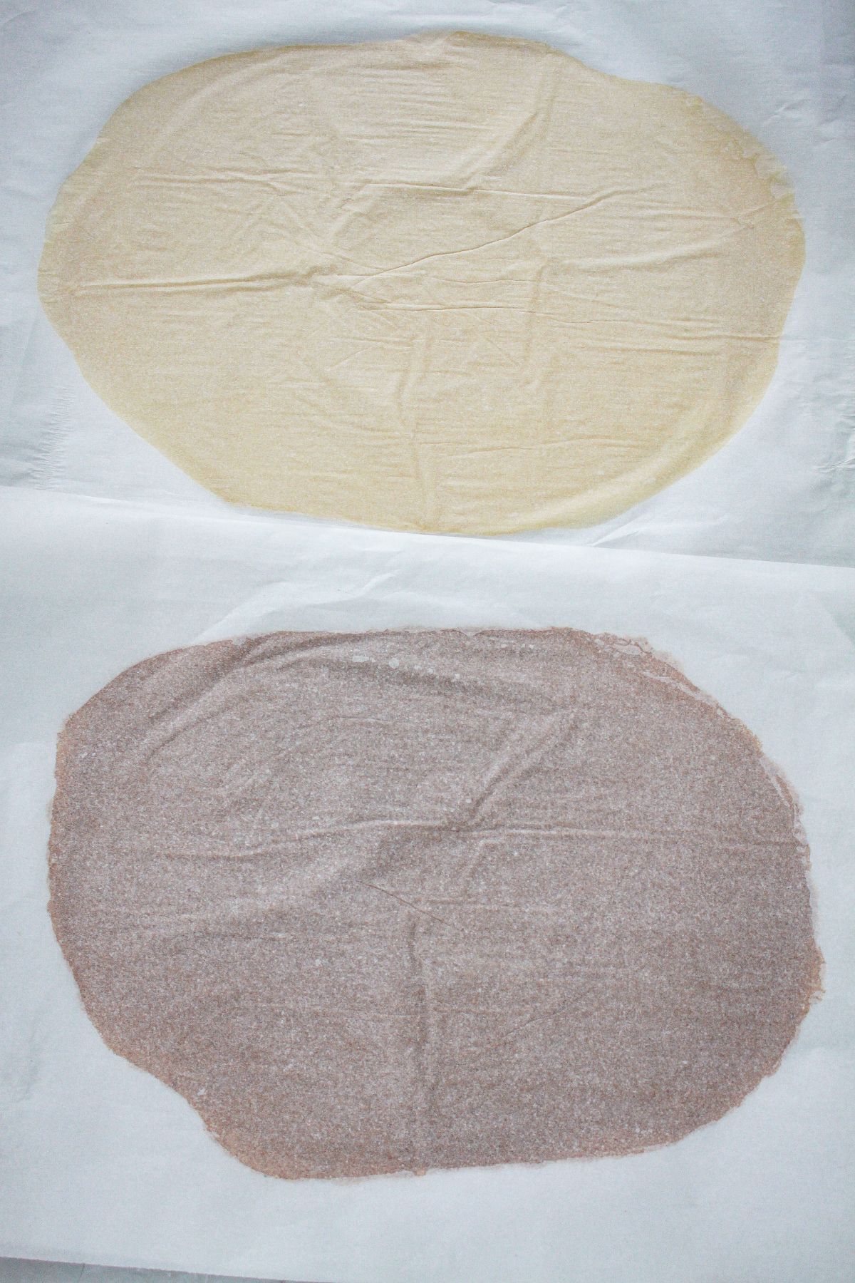 cookie dough layers being rolled out into two different layers.
