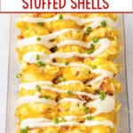 finished crack chicken stuffed shells on a glass baking dish.