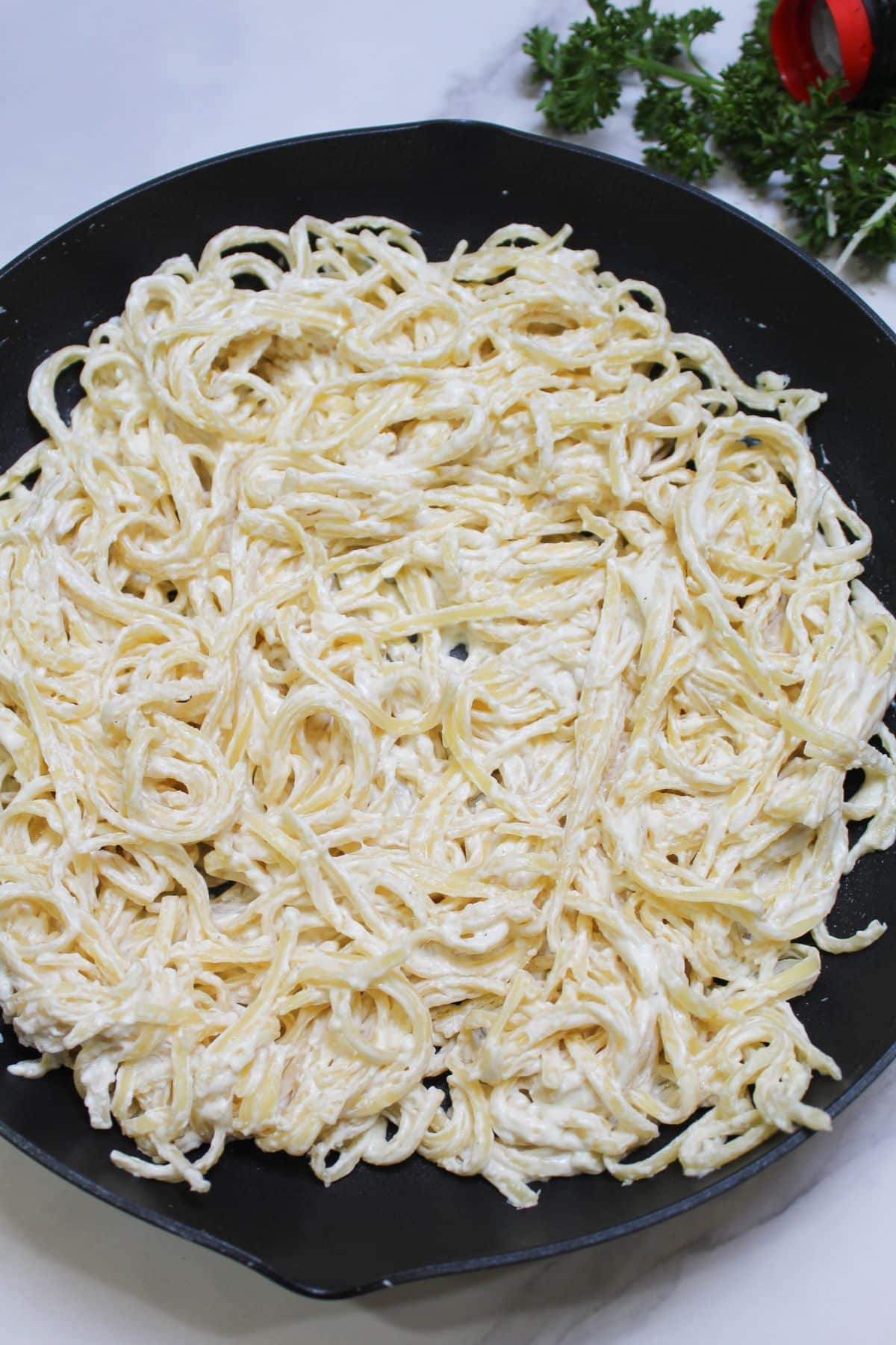cream cheese pasta in a skillet.