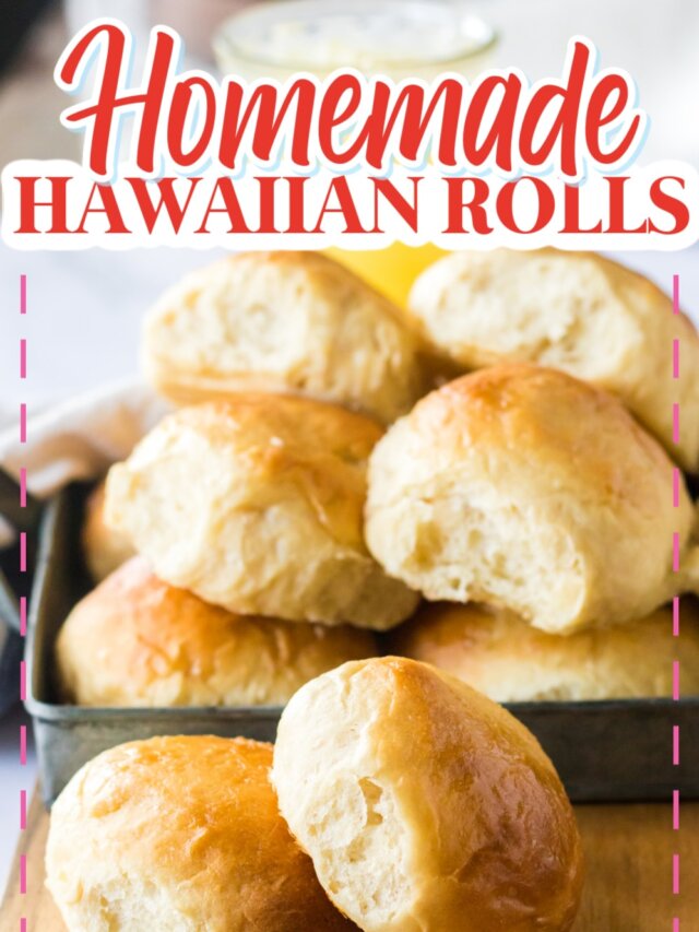 two homemade hawaiian rolls on a wooden cutting board.
