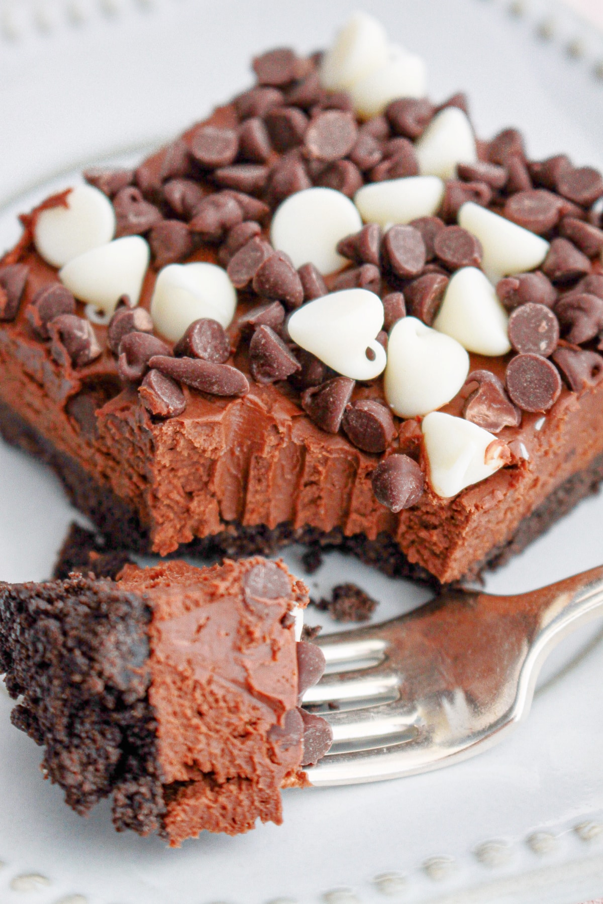 slice of death by chocolate cheesecake on a small plate.