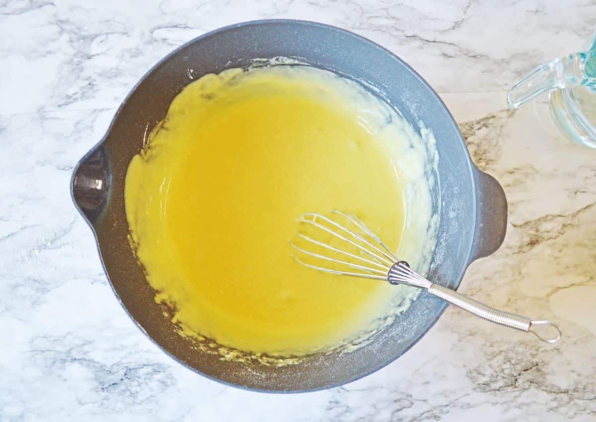 pudding being mixed in a mixing bowl.
