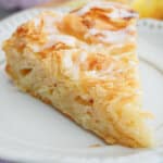 slice of lemon crinkle cake on a small plate.