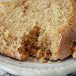 slice of maple pound cake on a small plate with a bite missing.