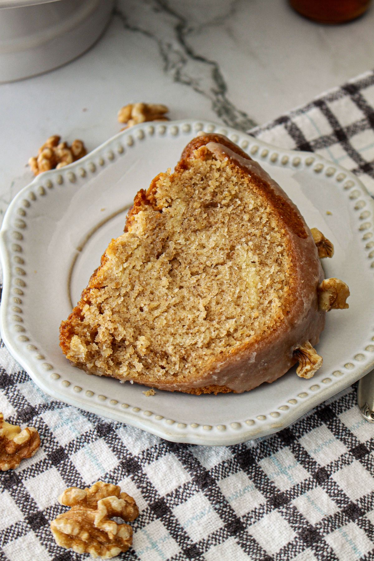slice of maple pound cake on a small plate.