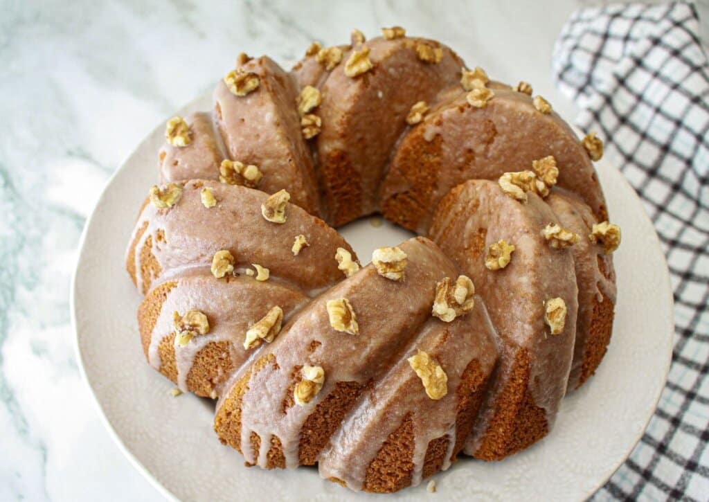 uncut pound cake on a serving platter.