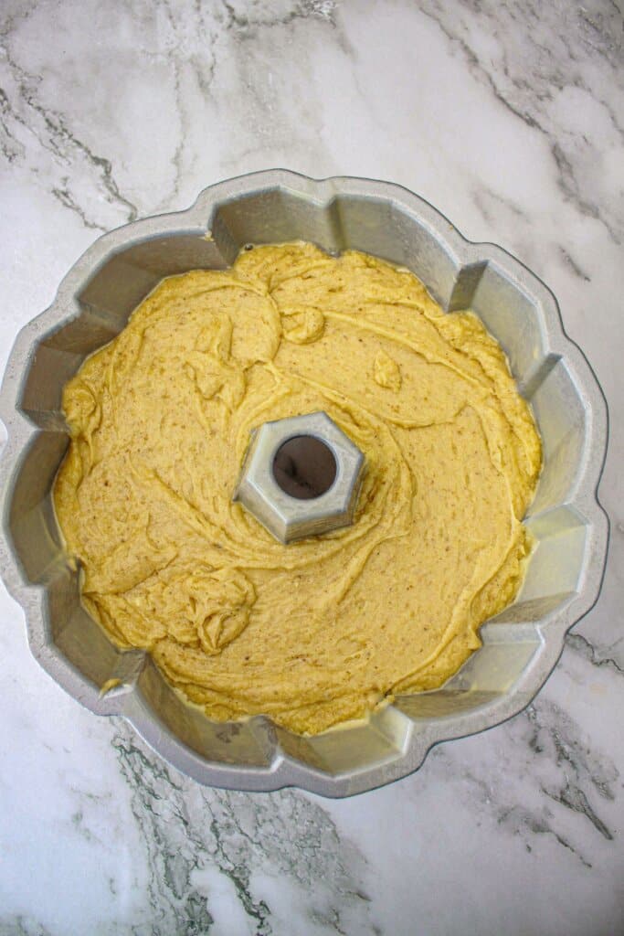 cake batter in a bundt cake pan ready for the oven.