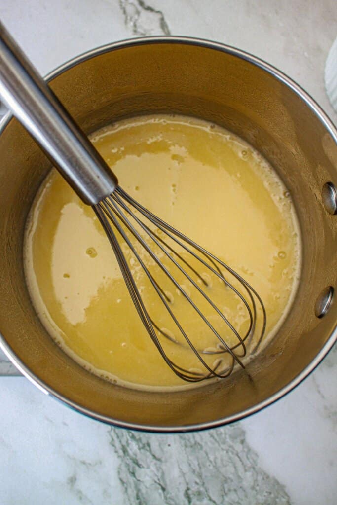 glaze being heated in a saucepan.