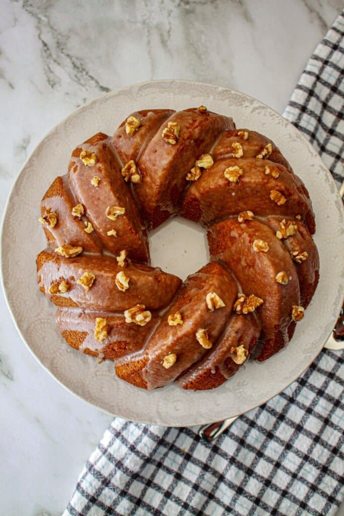 uncut maple pound cake on a serving platter.