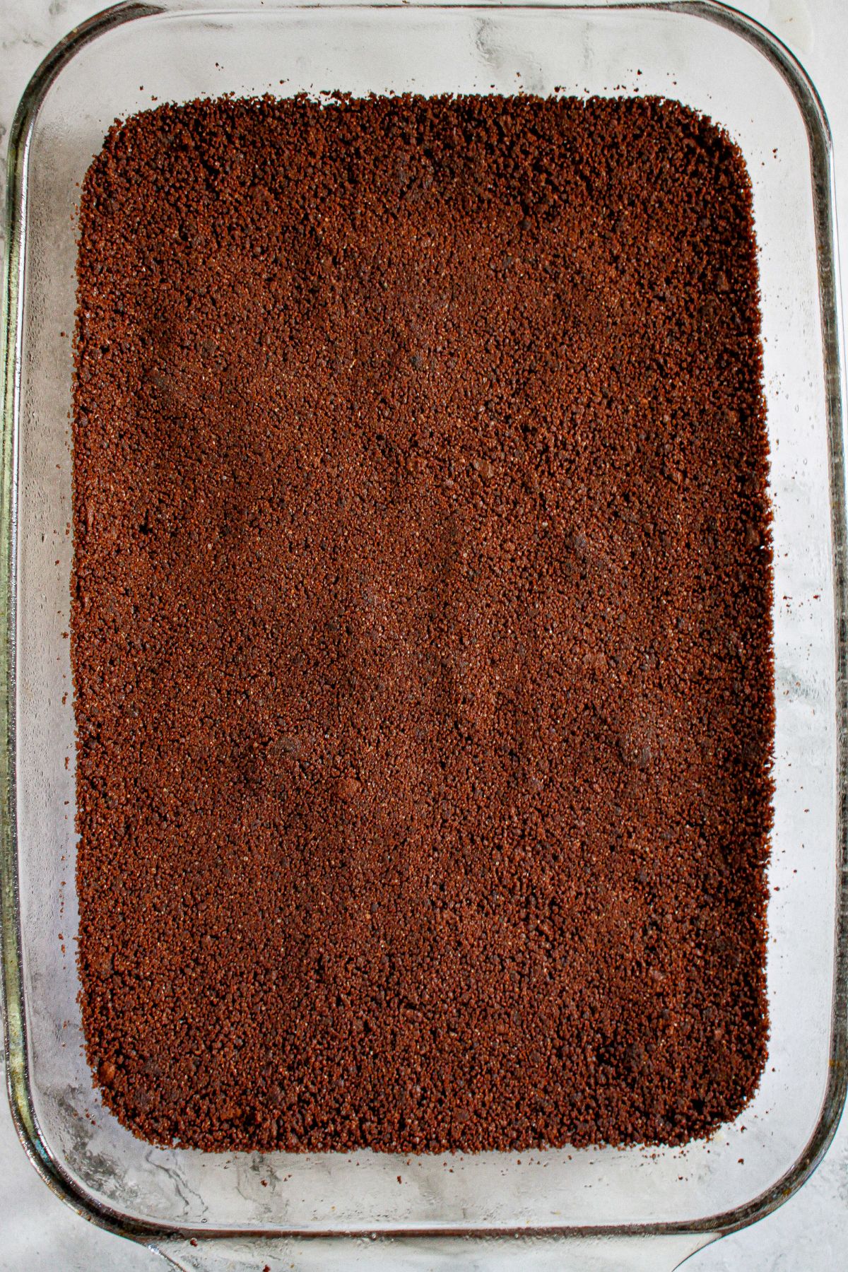 crust pressed into a glass baking dish.