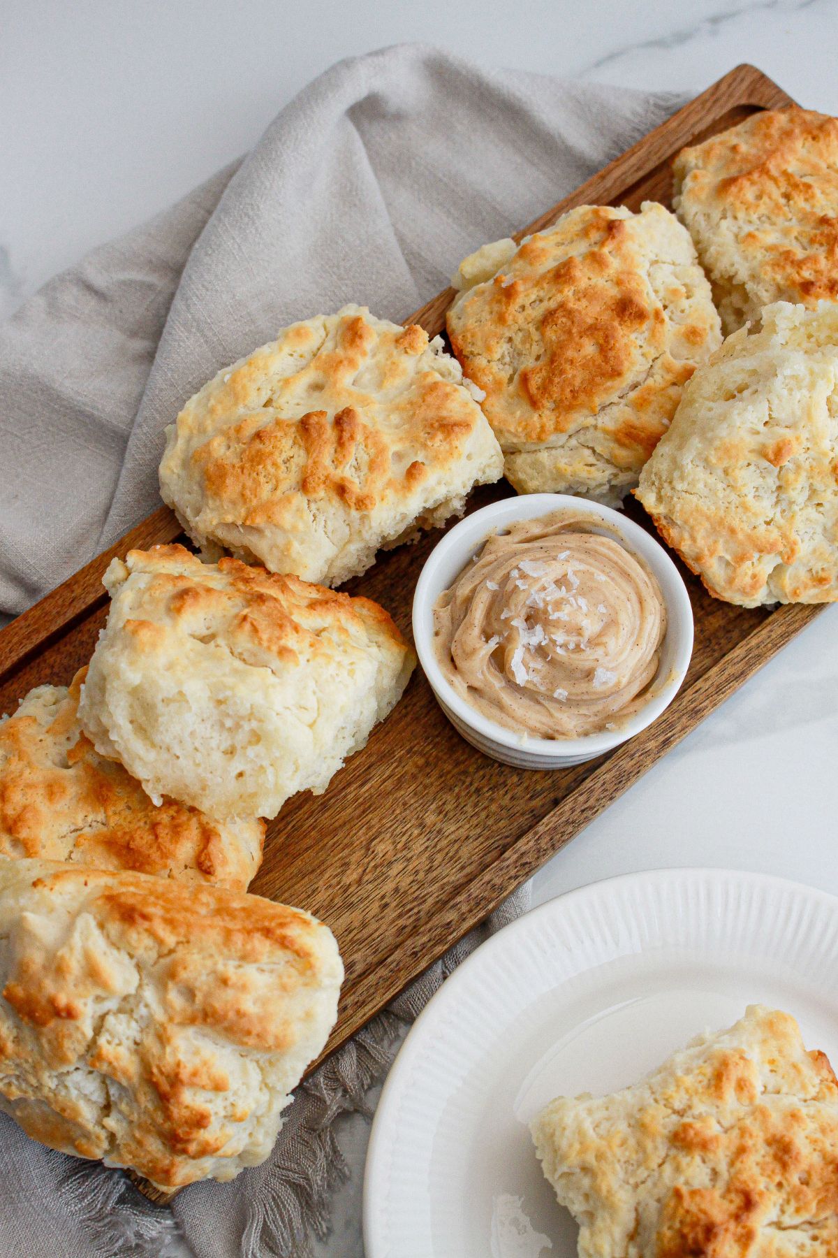 mountain dew biscuits on a wooden serving tray.