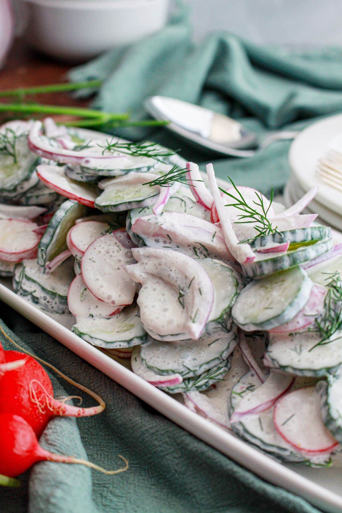 platter full of radish cucumber salad.