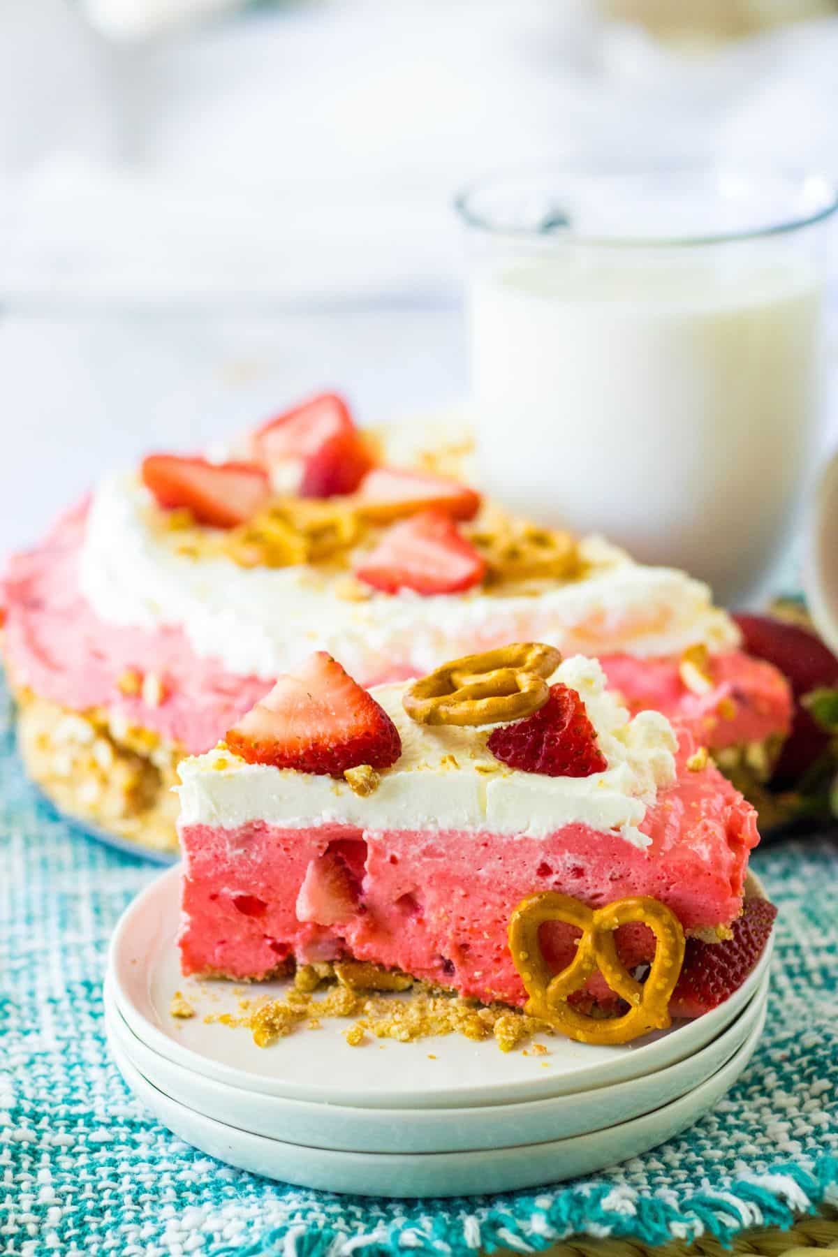 slice of strawberry pretzel pie on a plate.