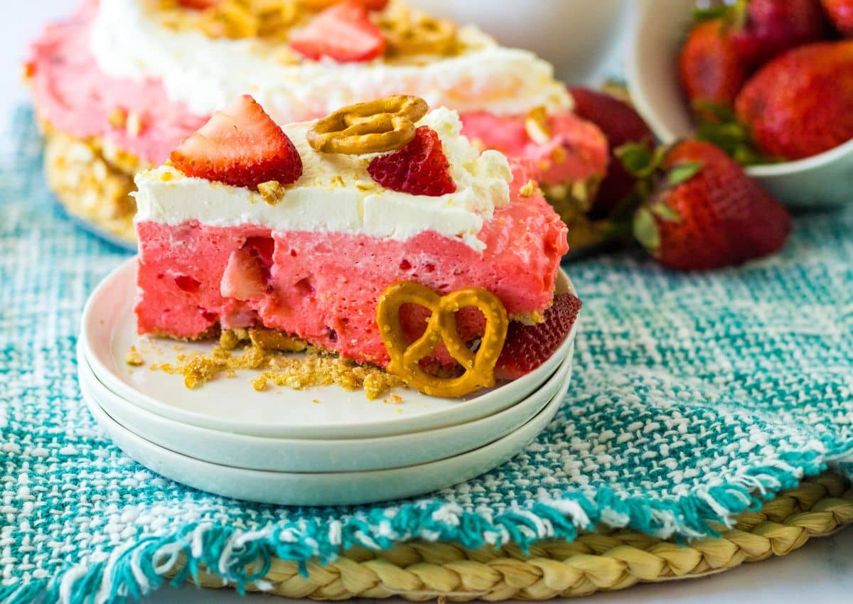 slice of strawberry pretzel pie on a plate.