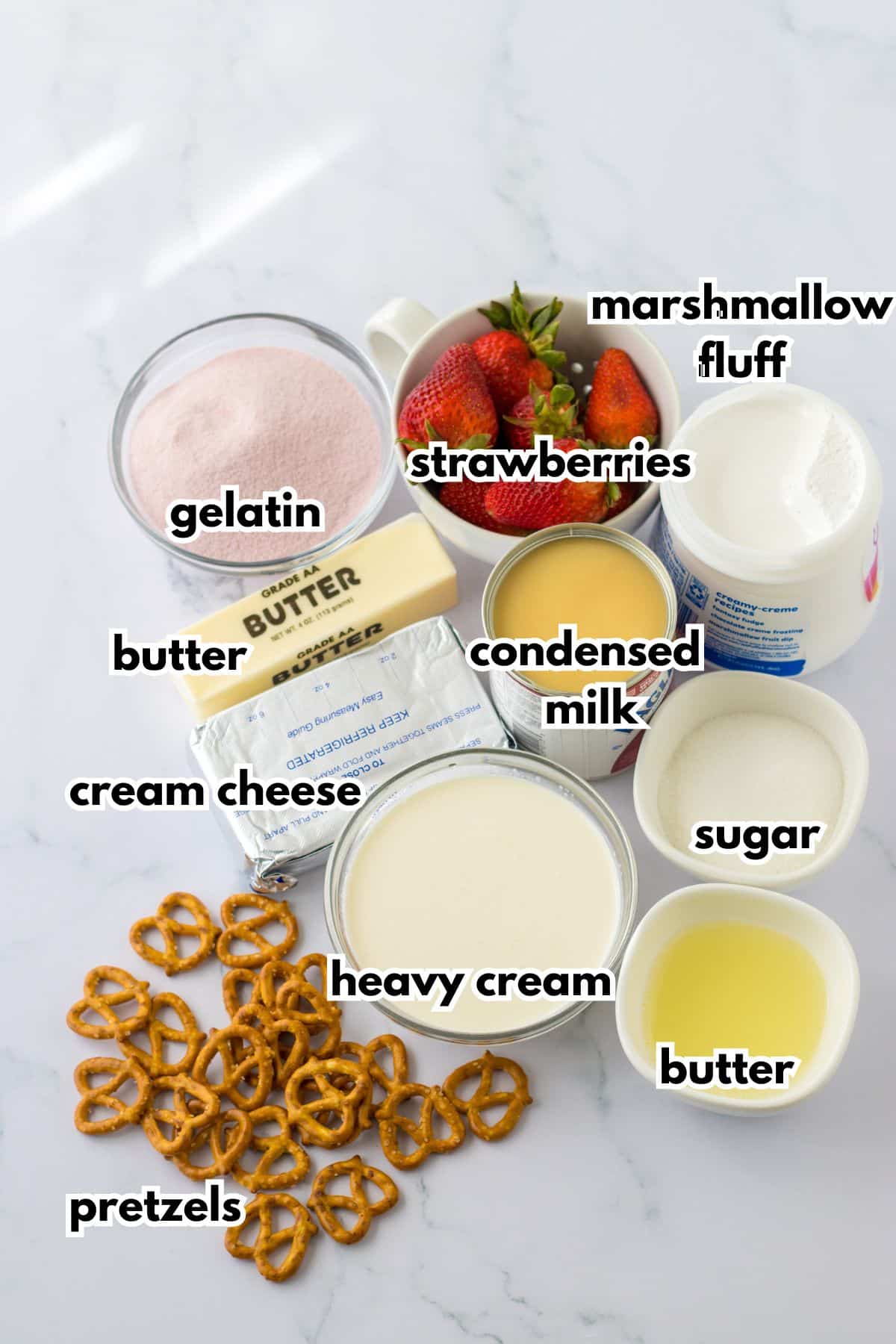 bowls of ingredients needed to make strawberry pretzel pie on a counter.