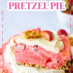 slice of strawberry pretzel pie being removed from the pie.