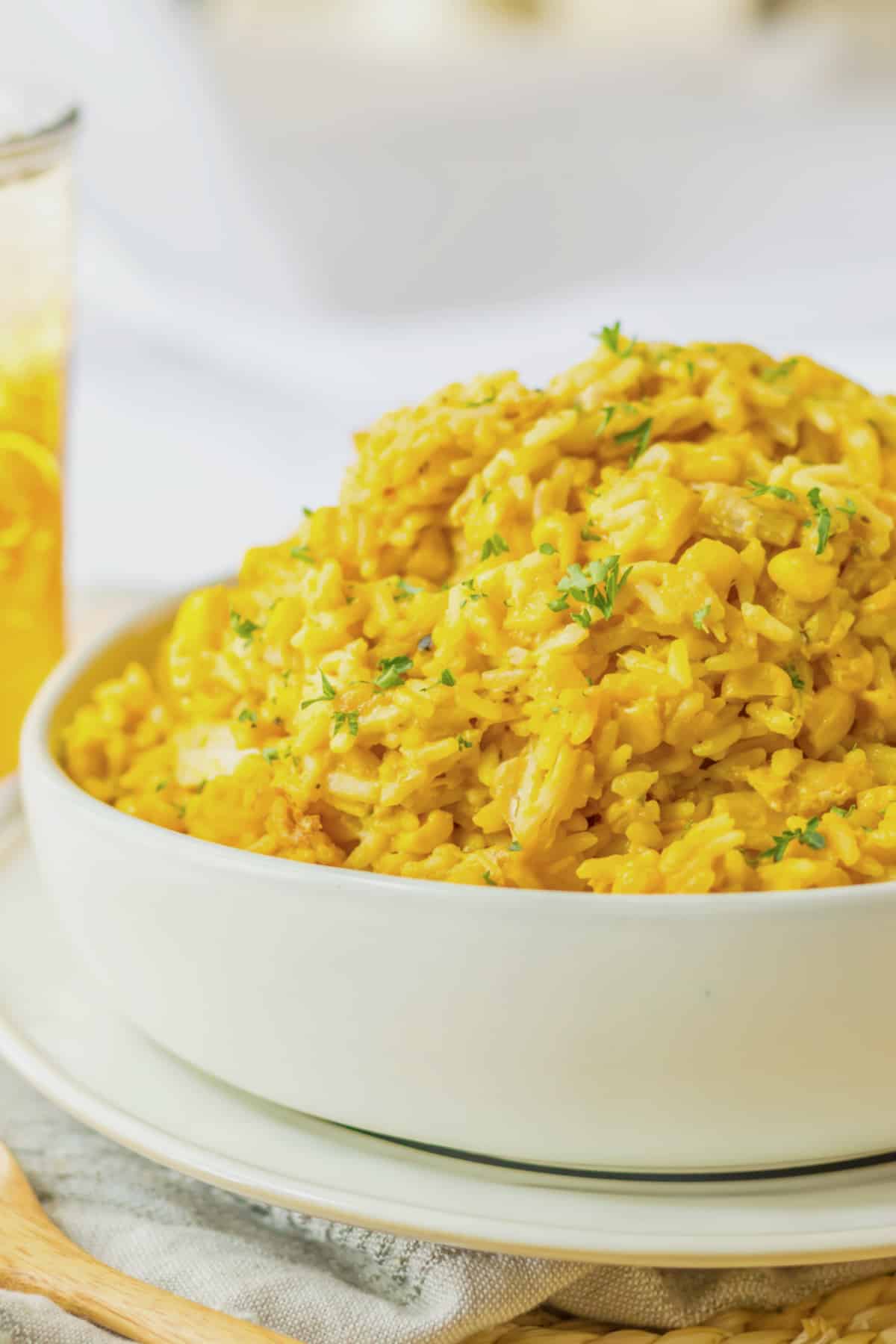 bowl of cheesy chicken and rice on a counter.