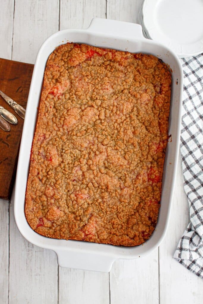 uncut cherry pie cheesecake bars in a baking dish.