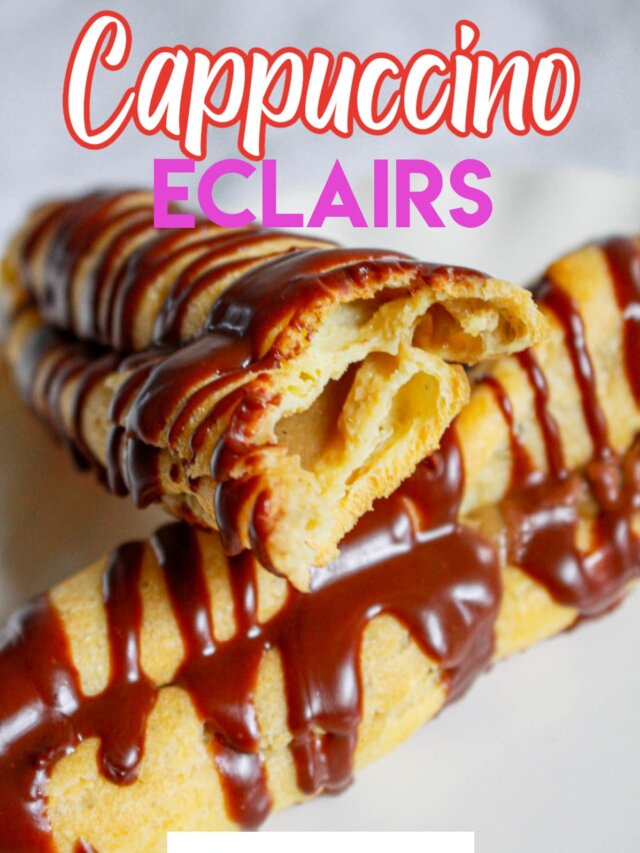 two cappuccino eclairs on a plate with one broken in half.