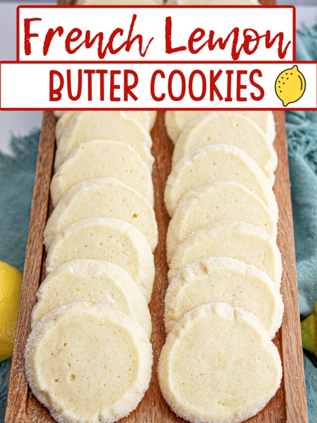 French lemon butter cookies lined up a wooden serving tray.