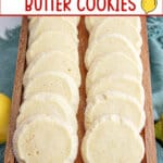 French lemon butter cookies lined up a wooden serving tray.