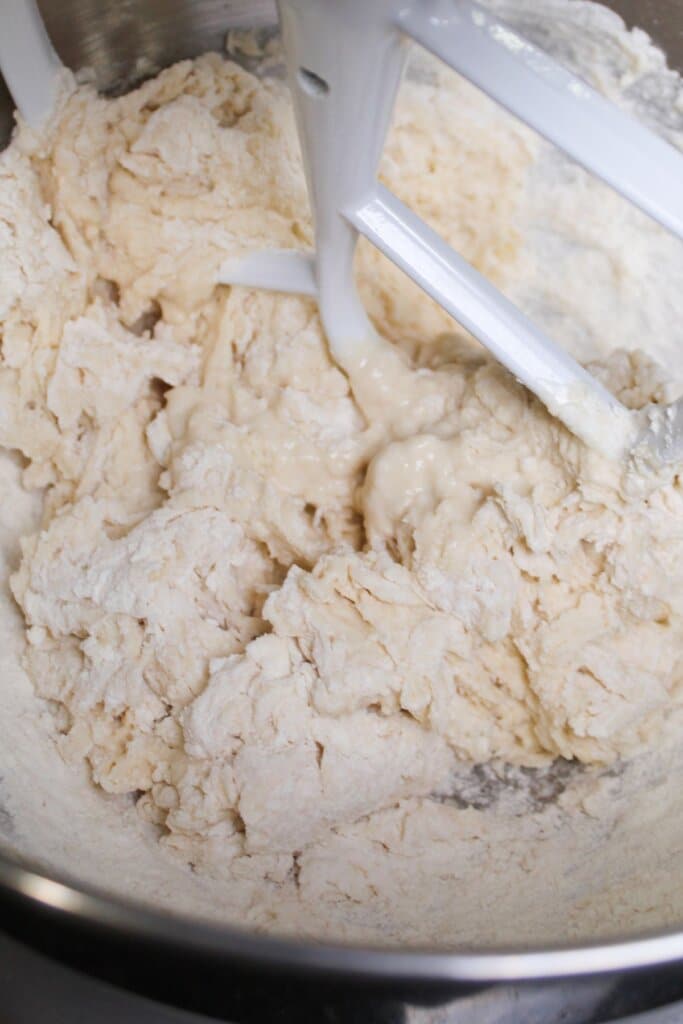 dough being mixed in a stand mixer.