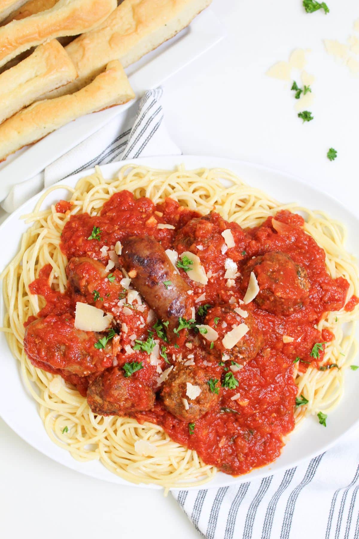 plate full of homemade pasta sauce and spaghetti noodles.