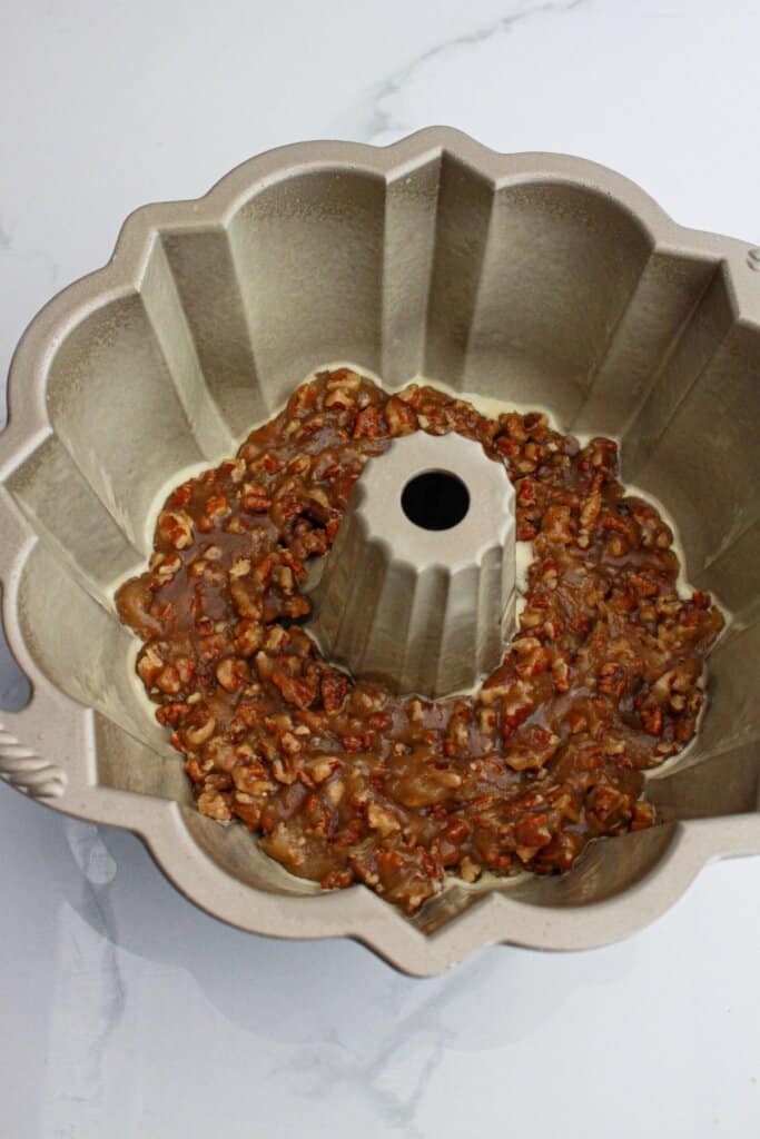 pecan topping in a greased bundt cake pan.