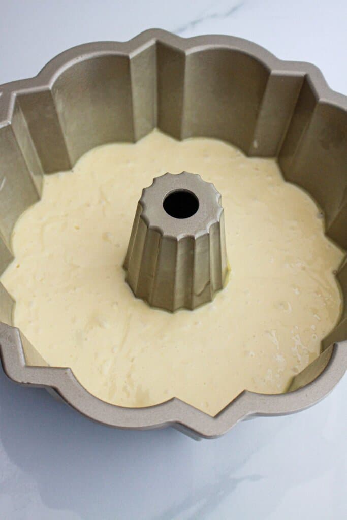 cake butter in a bundt cake pan.