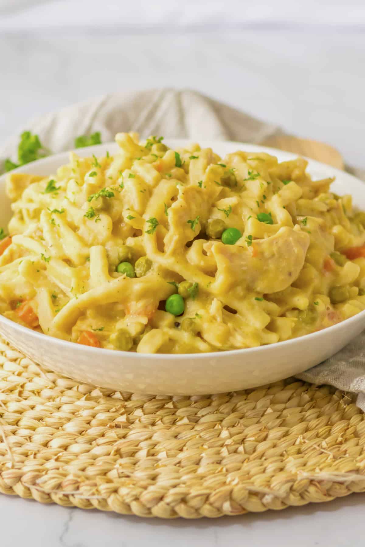 bowl full of slow cooker chicken and noodles.