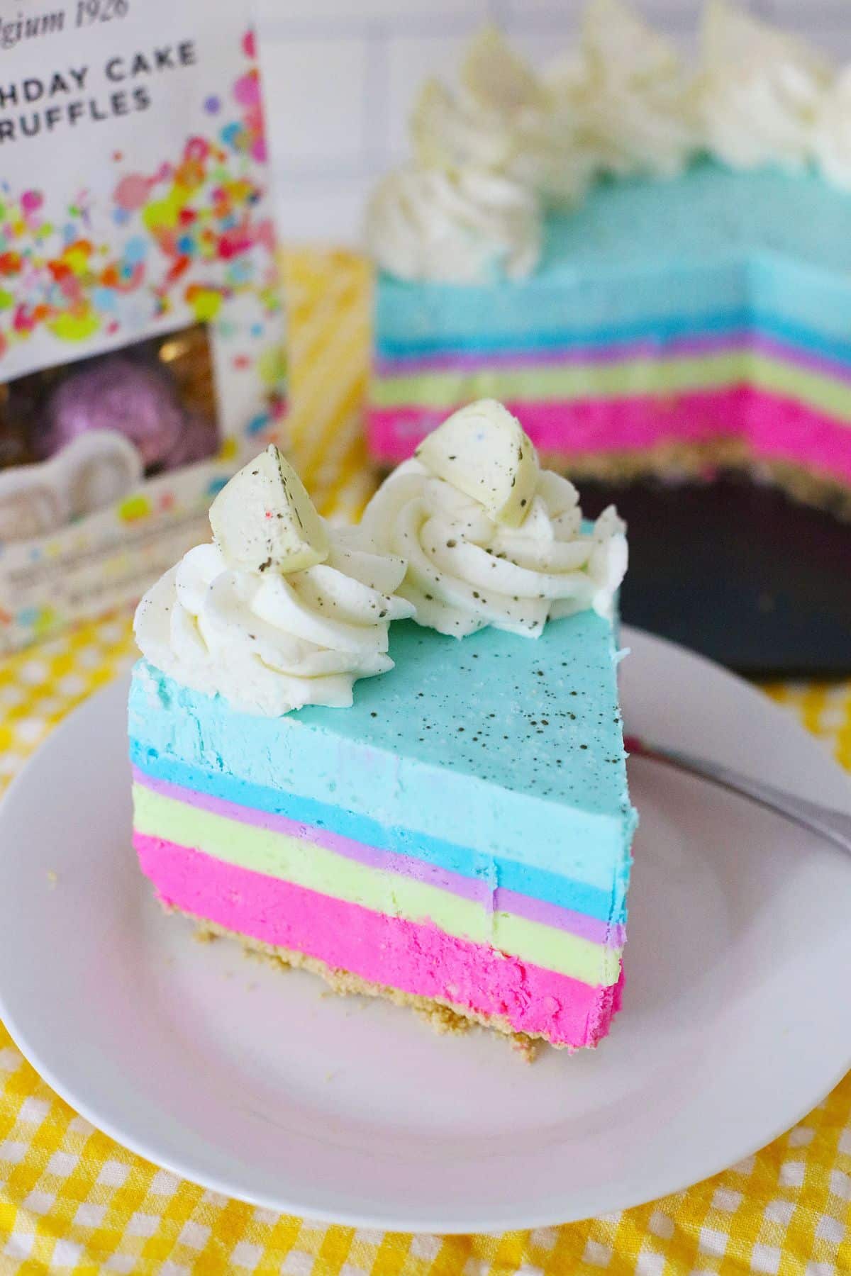 slice of birthday cake cheesecake on a small plate.