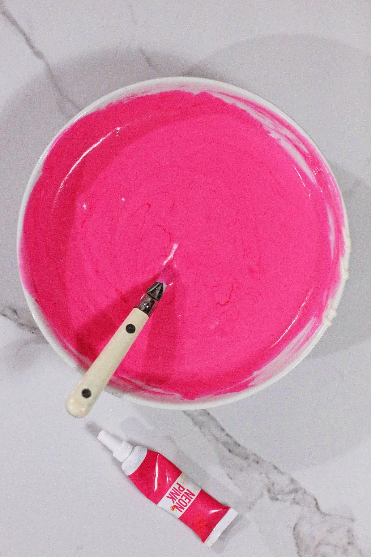 cheescake batter being colored pink.