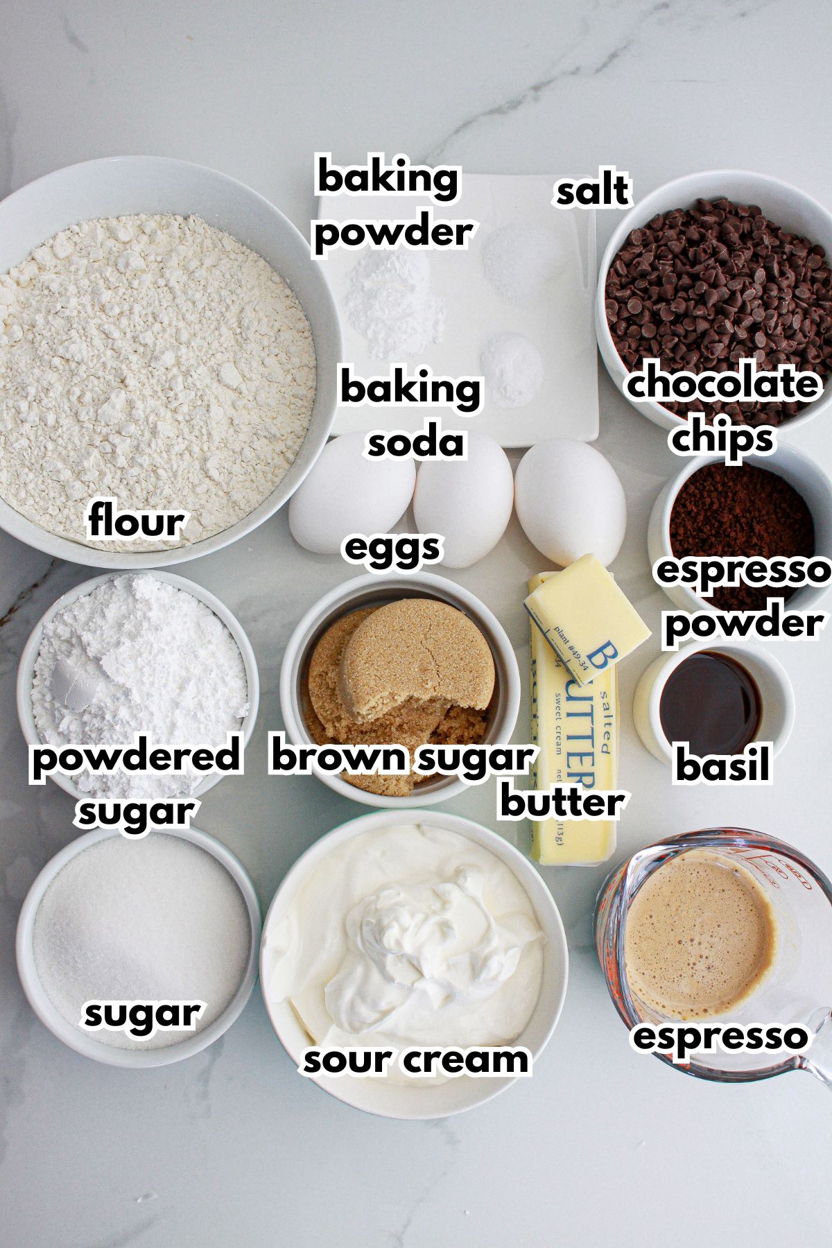 bowls of ingredients needed to make chocolate epsresso bundt cake on a counter ready for the oven.