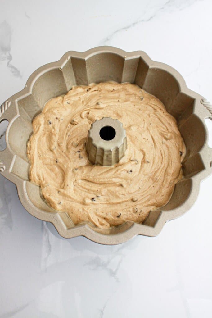 bundt cake batter in a bundt cake pan ready for the oven.