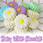 daisy oreo white chocolate covered oreos on a plate.