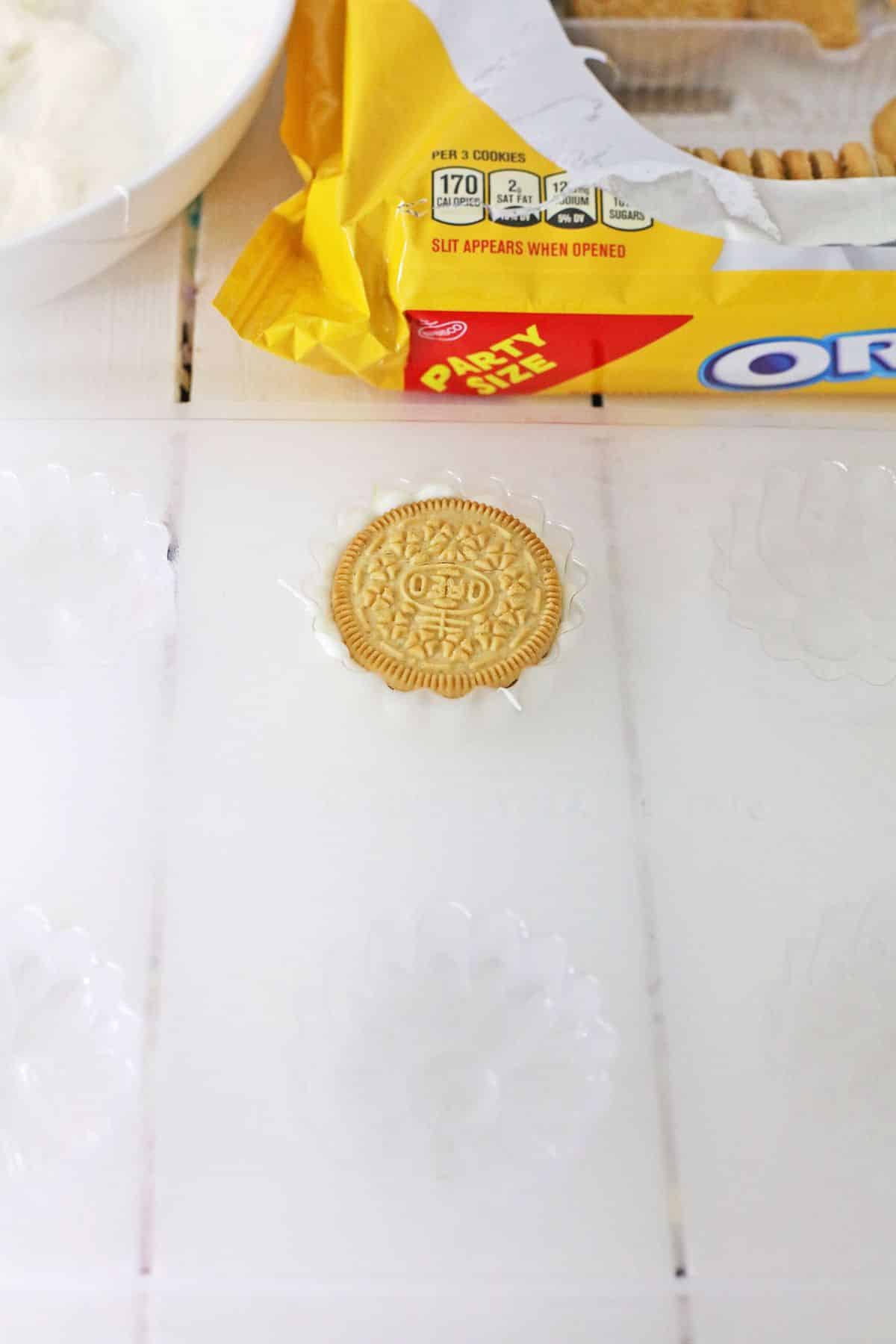 cookie being added to a plastic mold.