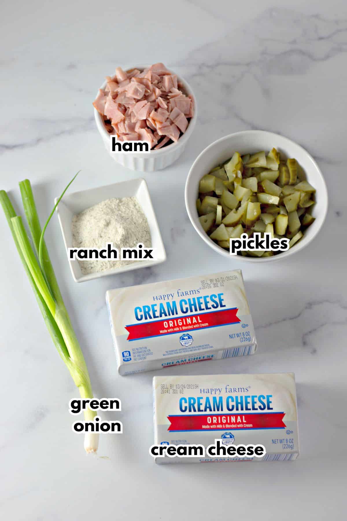 bowls of ham, ranch seasoning mix, pickles, cream cheese, and green onions.