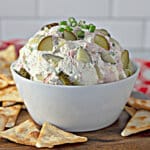 full of dill pickle dip on a counter.