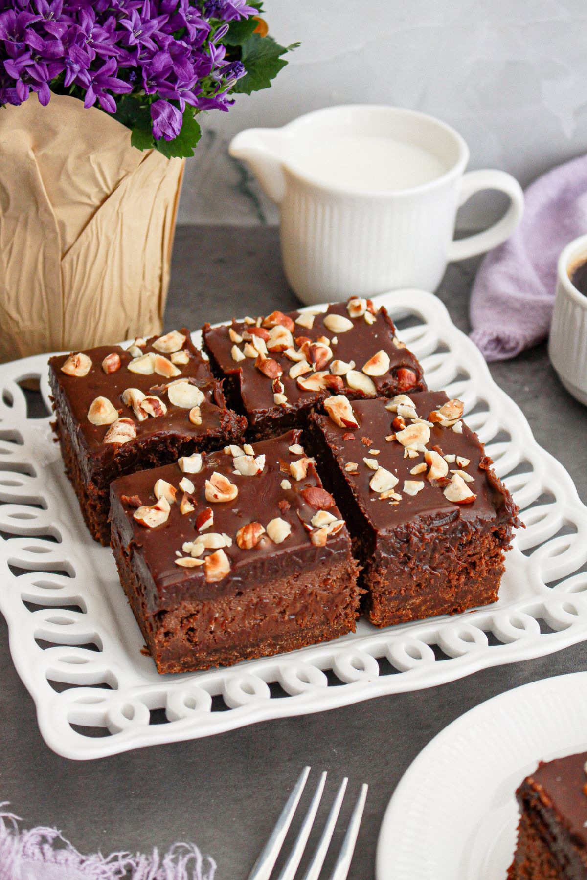 four nutella cheesecake bars on a small plate.
